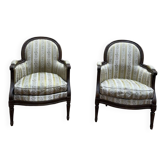 Paire de fauteuils - bergères de style Louis XVI