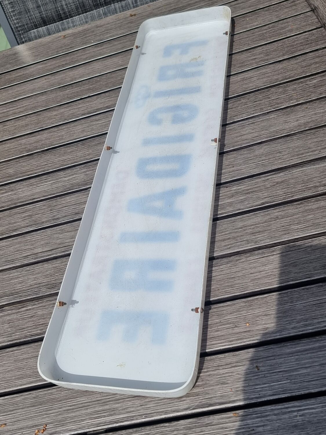 Old plastic fridge advertisement