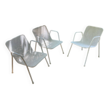 Perforated metal armchairs