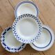 4 mismatched vintage deep plates in blue and white porcelain