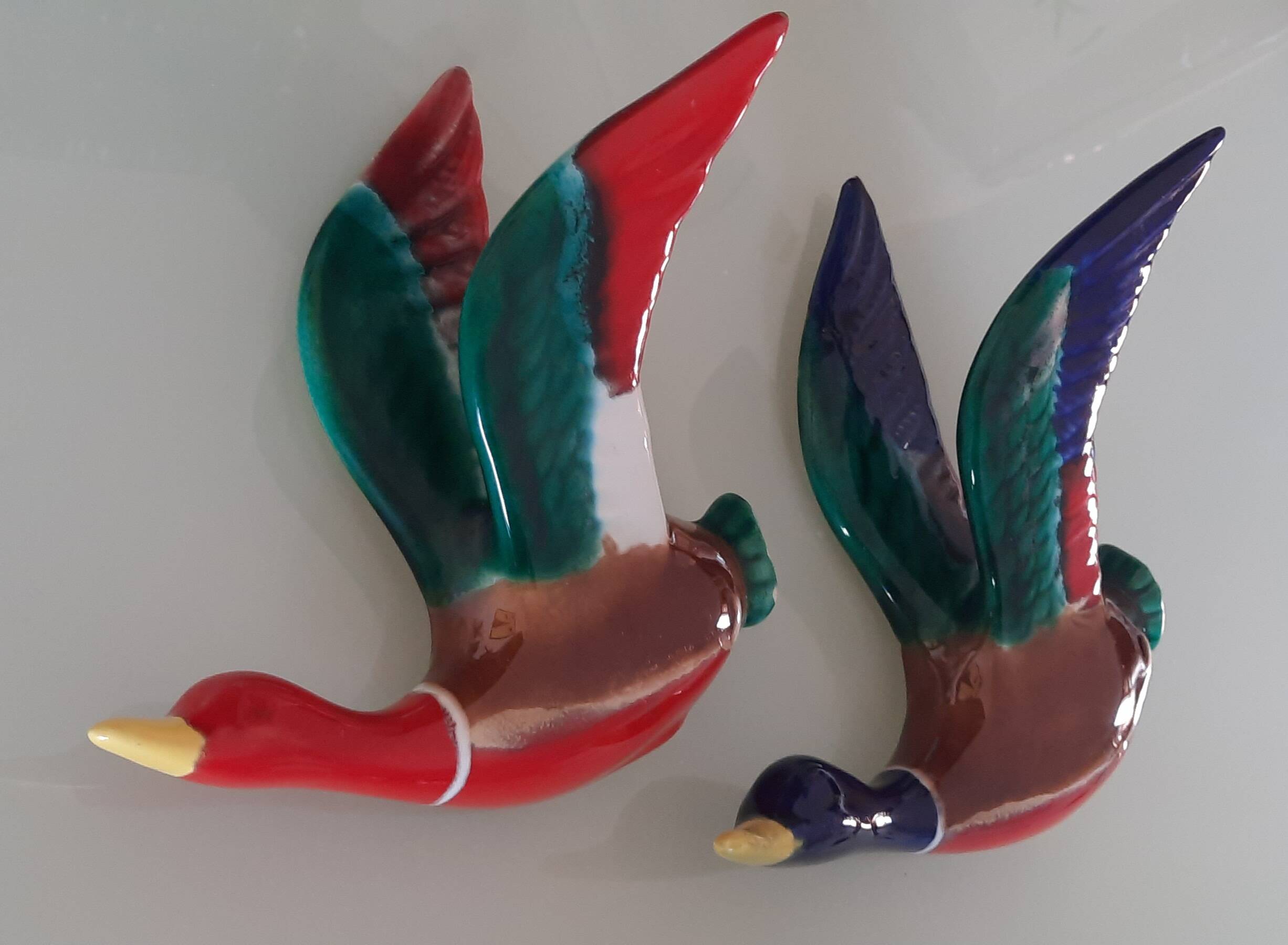 Pair of glazed ceramic wall ducks