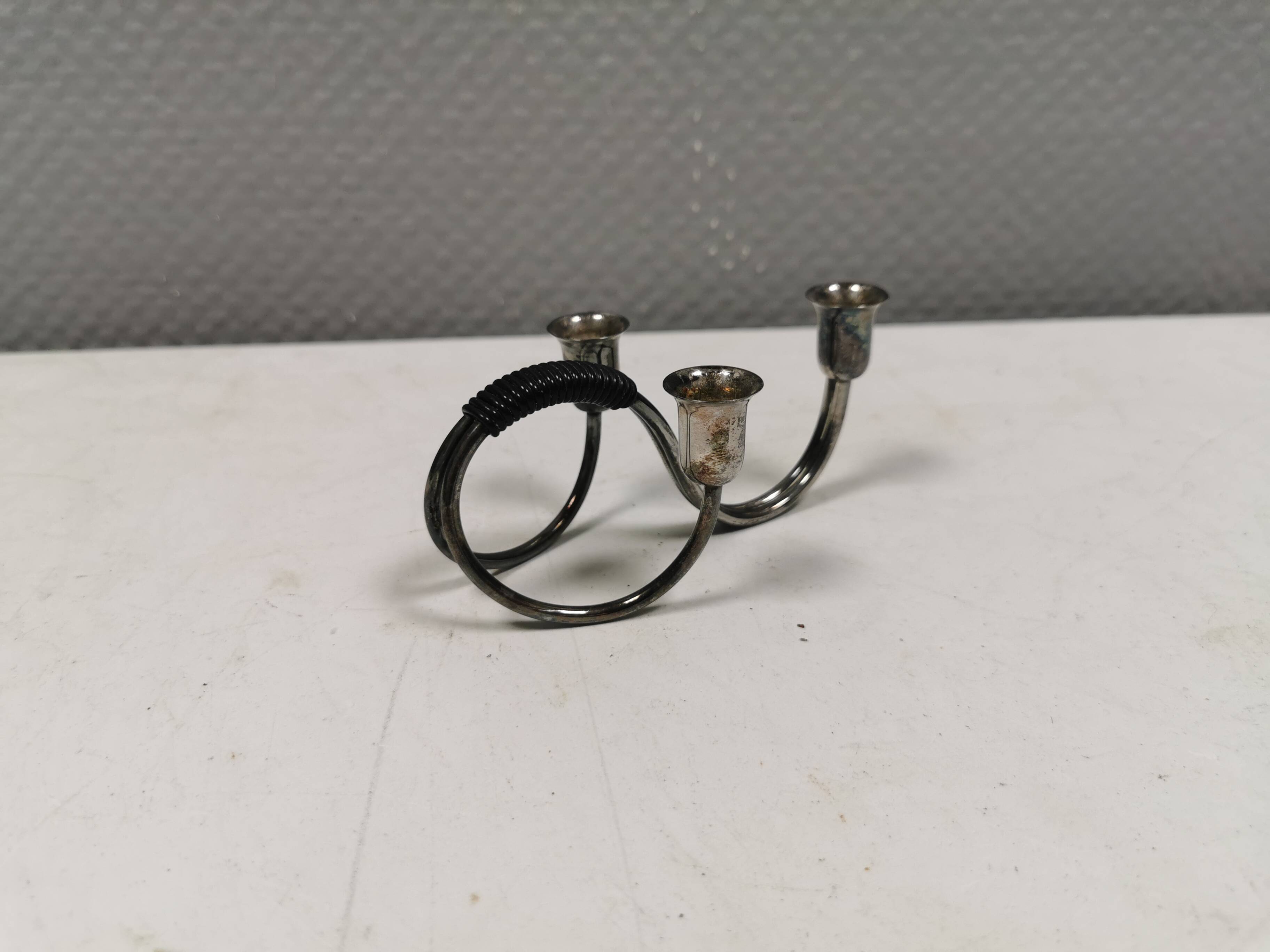 Small candle holder in tarnished silver, with place for three small candles