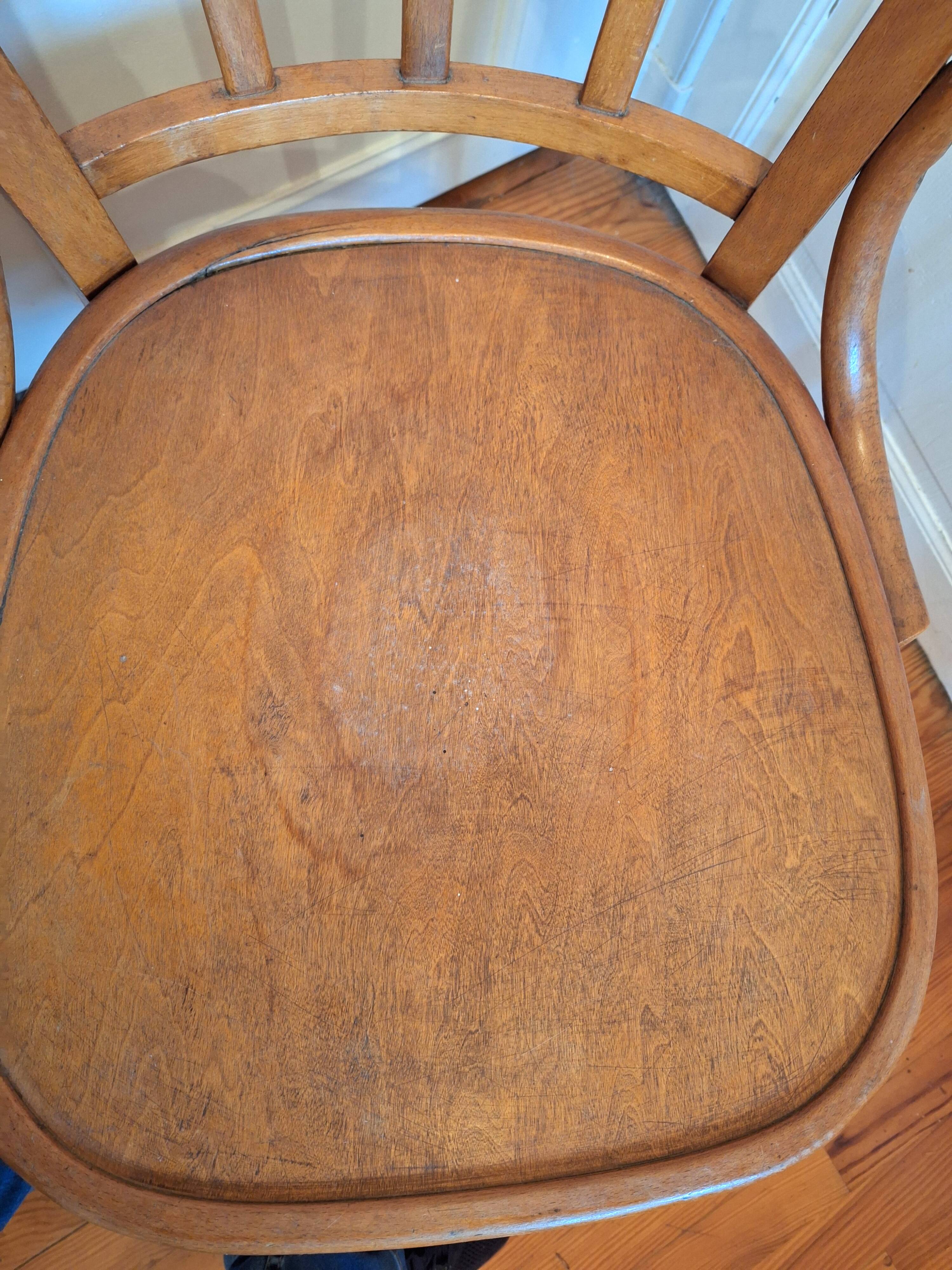 Curved wooden armchair