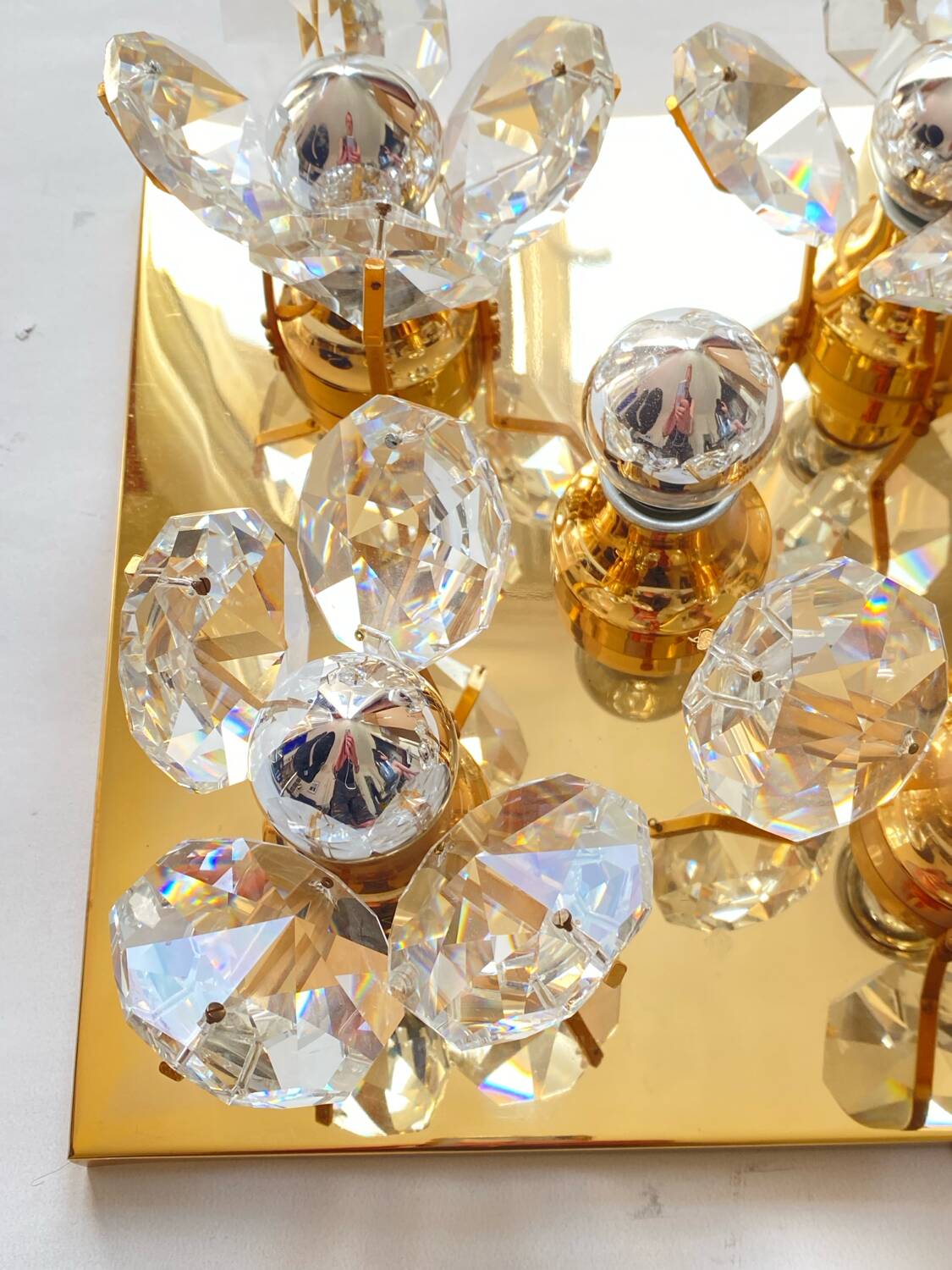 Brass wall lamp with glass prisms