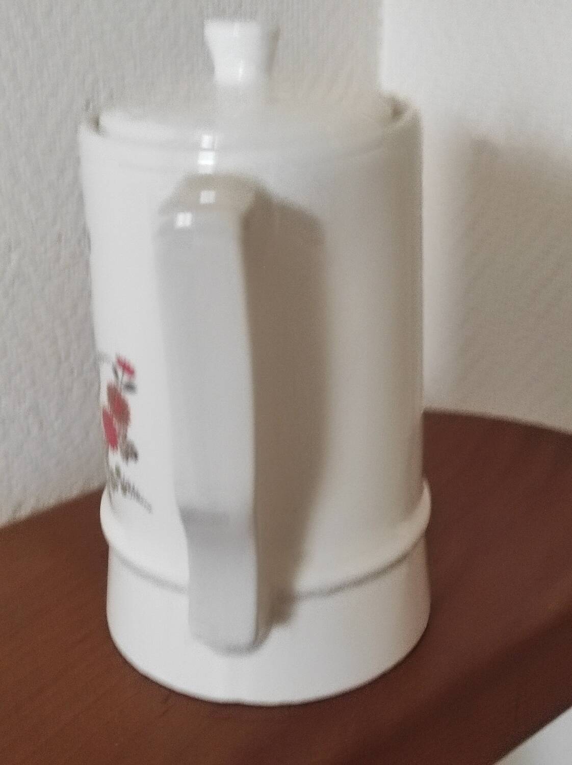 Small coffee maker with floral decoration