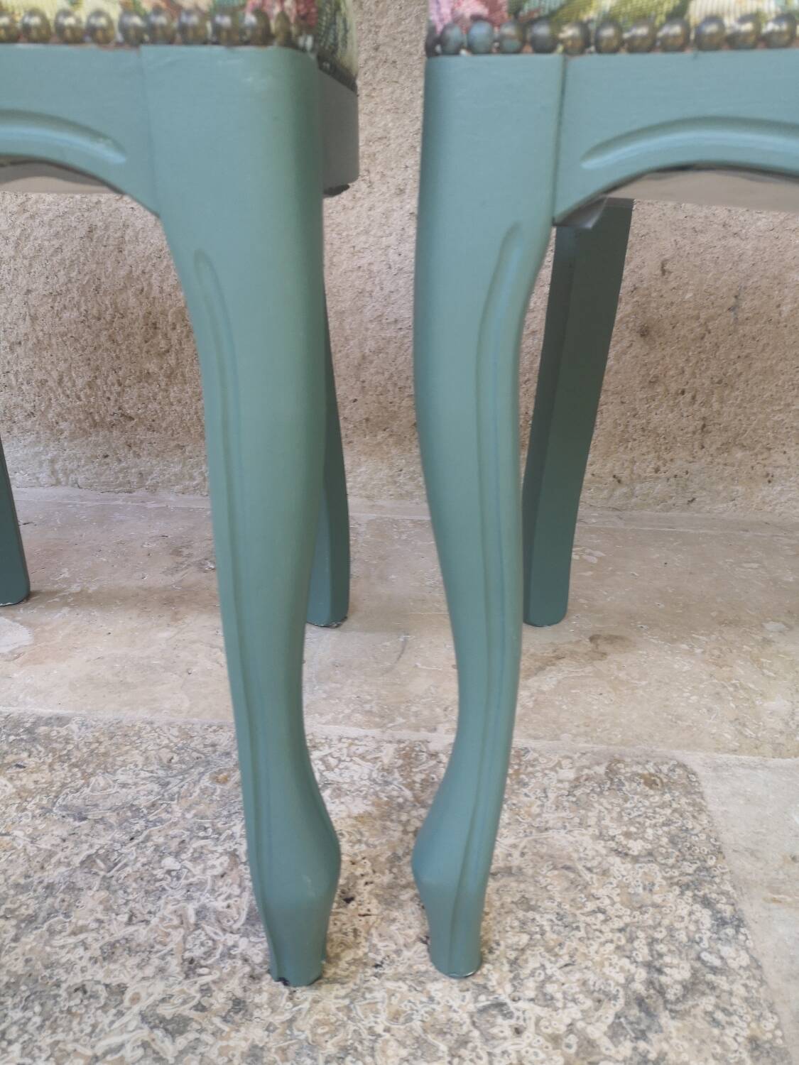 Antique chairs with studded upholstery.