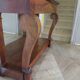 Empire/Restoration style console table with scrolled ends, mirrored back, and claw feet.