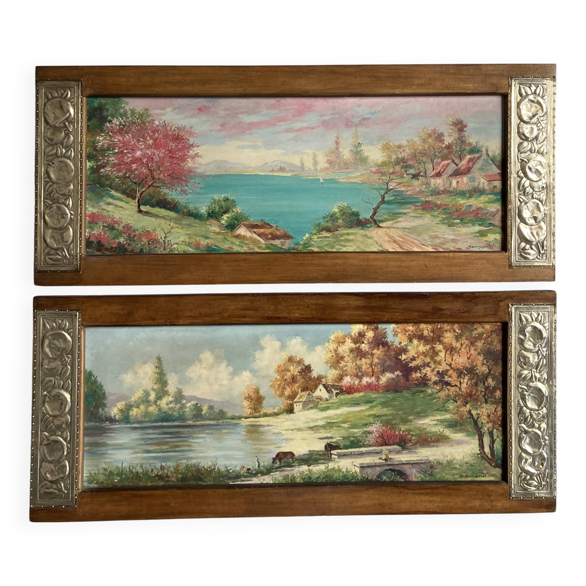 Pair of Art Deco wood and embossed metal landscape frames