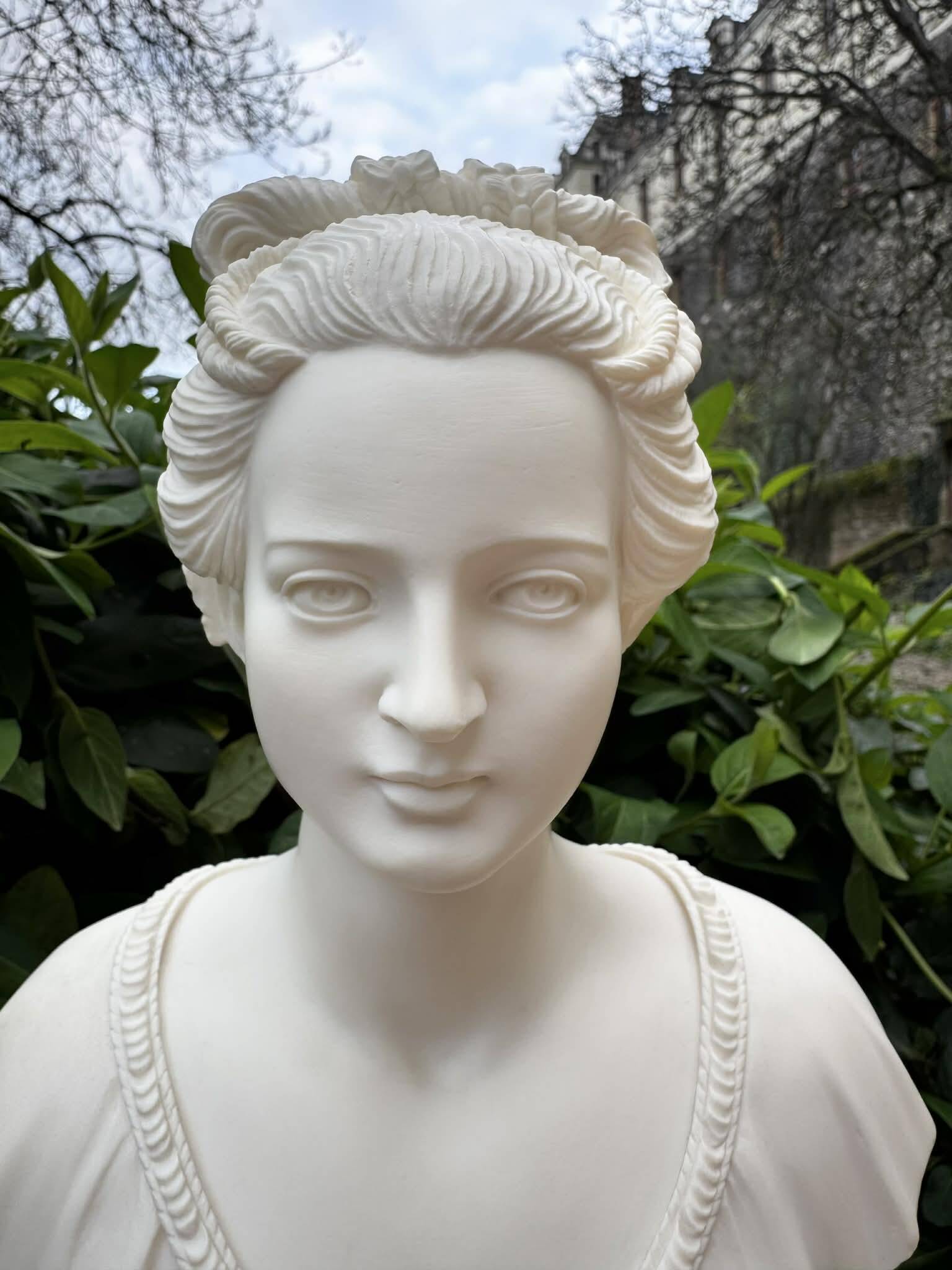 Alabaster bust of a woman signed Arnaldo Giannelli dated 1980.