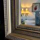 Large antique beveled mirror in the Napoleon III style - Gold and black frame
