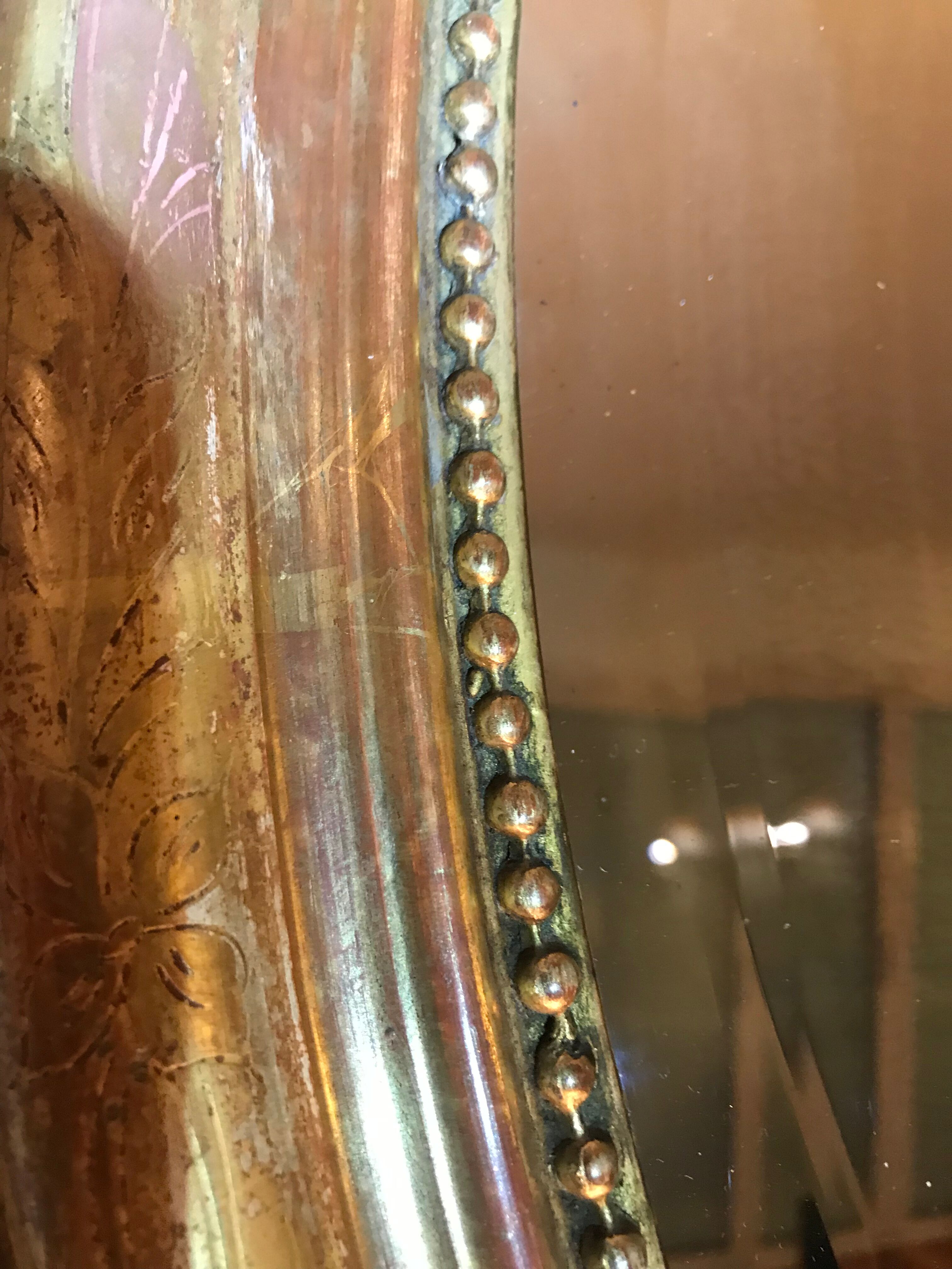 Oval mirror Louis XVI gold leaf