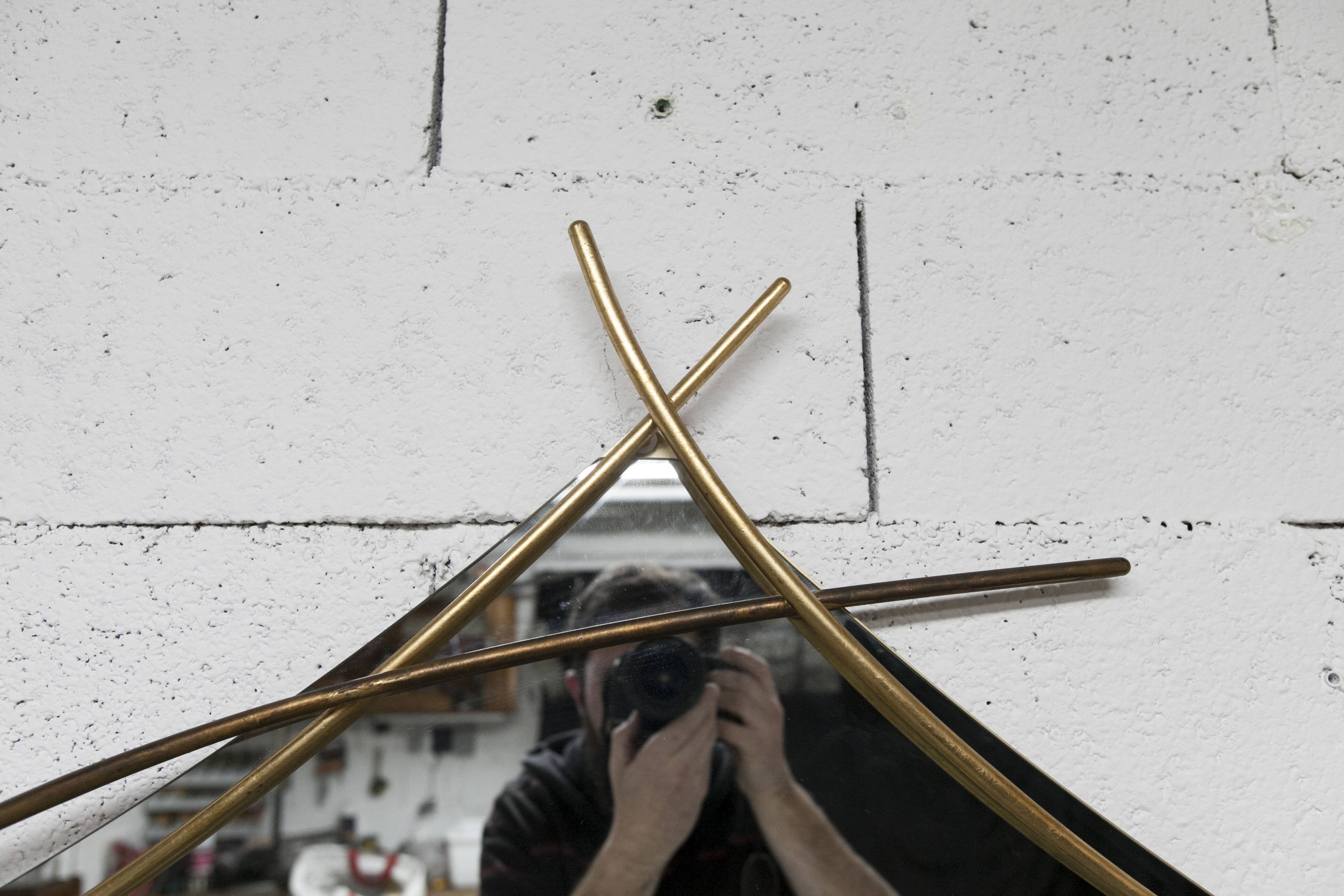 Sculptural mirror with two-tone gilded arches, France, 1970s, 95 x 133 cm