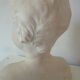 Bust young boy in plaster