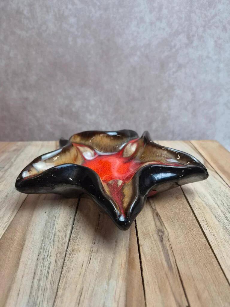 Vintage starfish bowl in ceramic Vallauris red and black lava style.