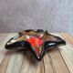 Vintage starfish bowl in ceramic Vallauris red and black lava style.