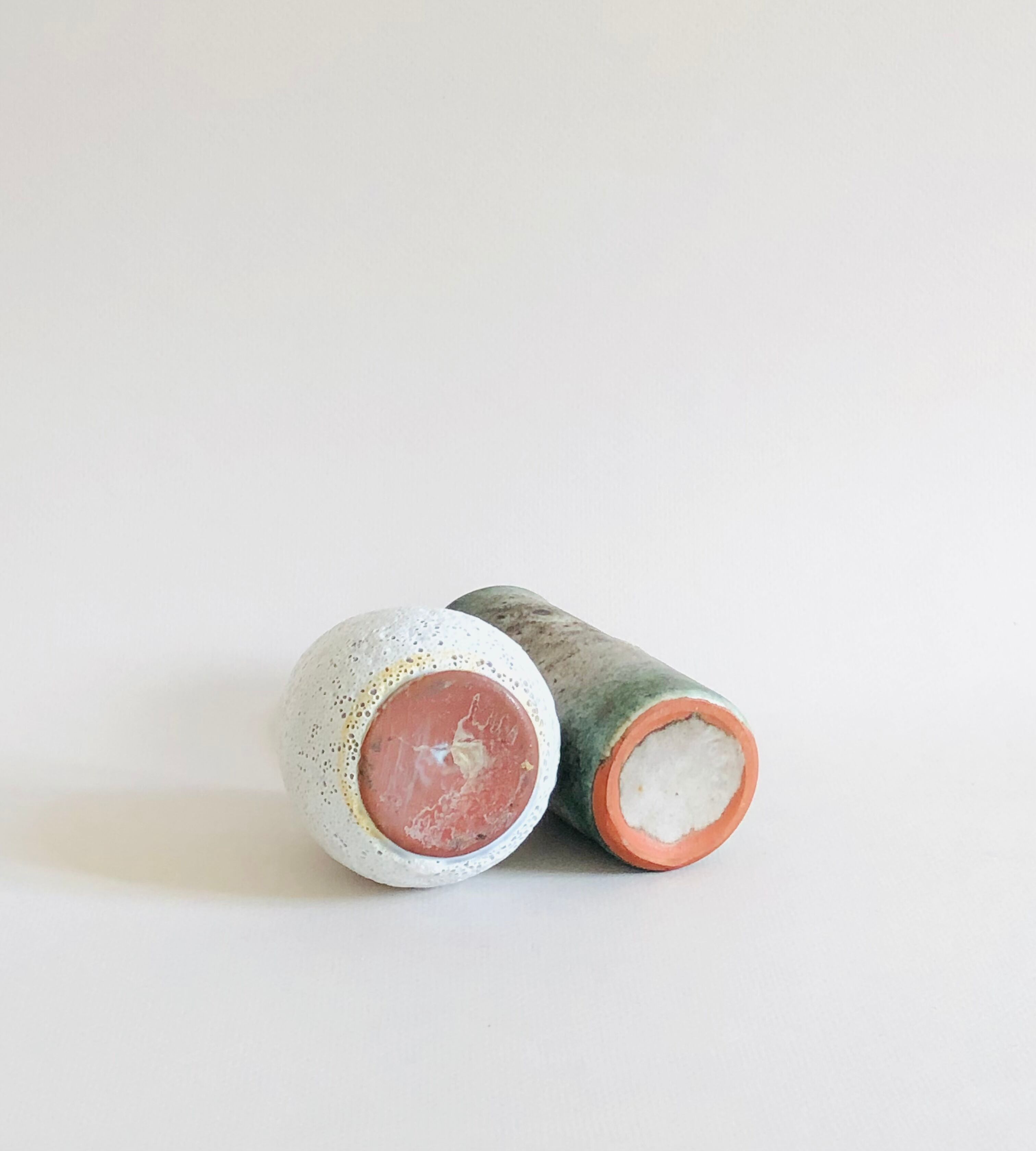 Duo of small sandstone vases