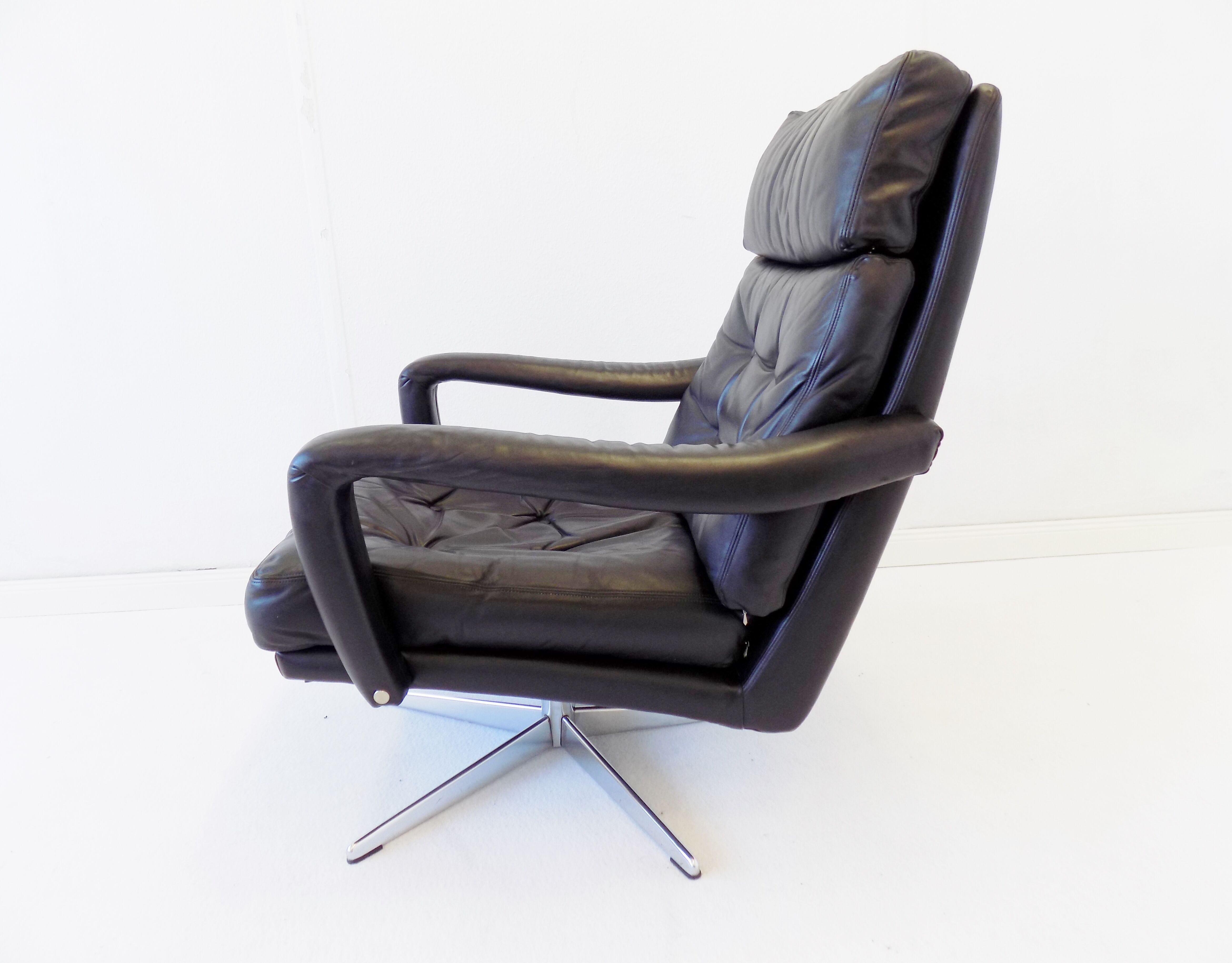 Danish black leather armchair with ottoman 70s