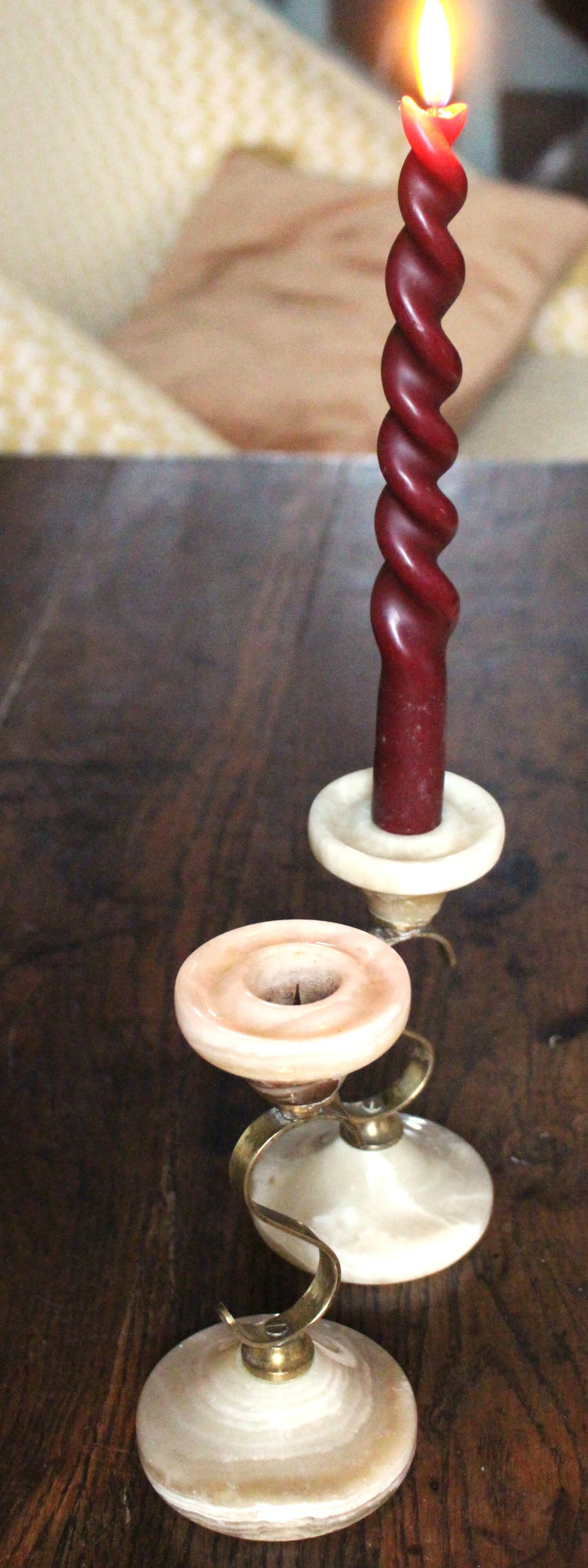 Pair of curved brass candlesticks with onyx