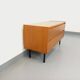 Small vintage Scandinavian sideboard in modernist style made of light oak wood.