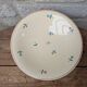 Round serving dish Moulin des Loups Orchies with small flower decoration 25.5cm