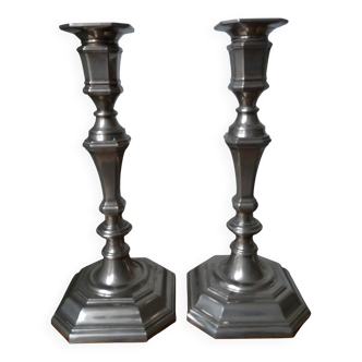 Pair of silver-plated metal candlesticks with cut sides