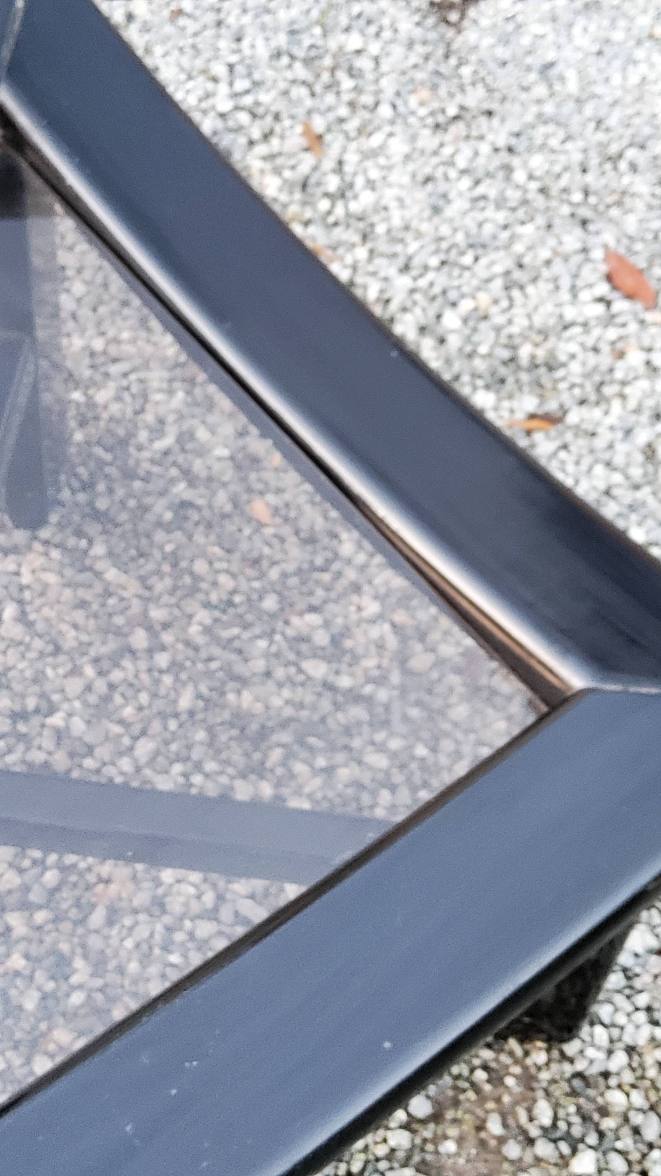 70s design coffee table in black lacquered wood with smoked glass top