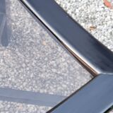 70s design coffee table in black lacquered wood with smoked glass top