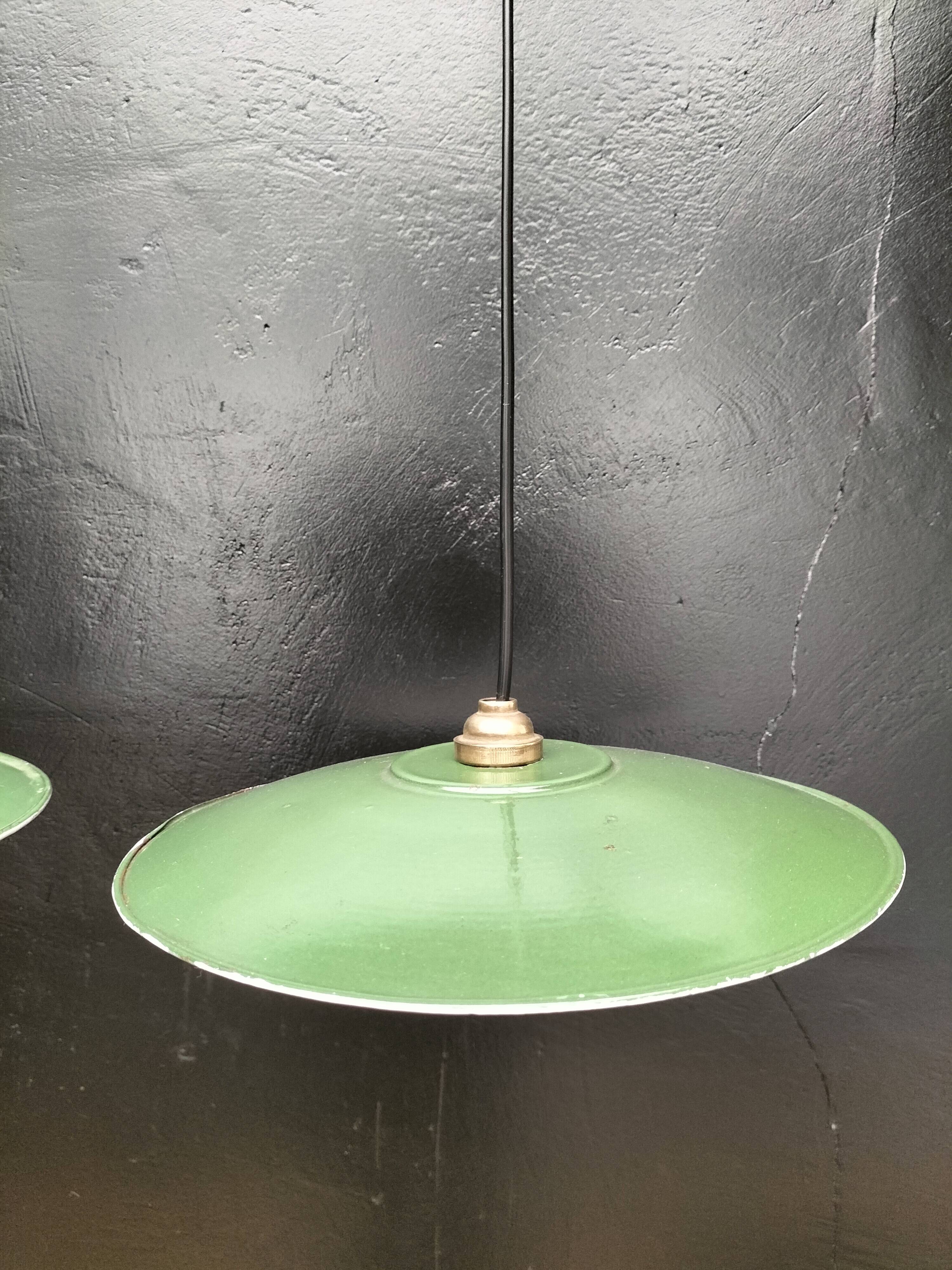 Three enamelled sheet metal suspensions