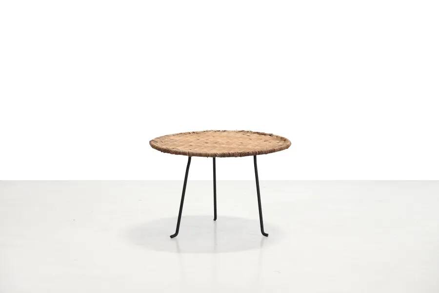 Round rattan side table by Raoul Guys