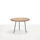 Round rattan side table by Raoul Guys