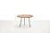 Round rattan side table by Raoul Guys