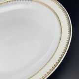 Plat rond creux en porcelaine de Limoges liseré jaune et doré