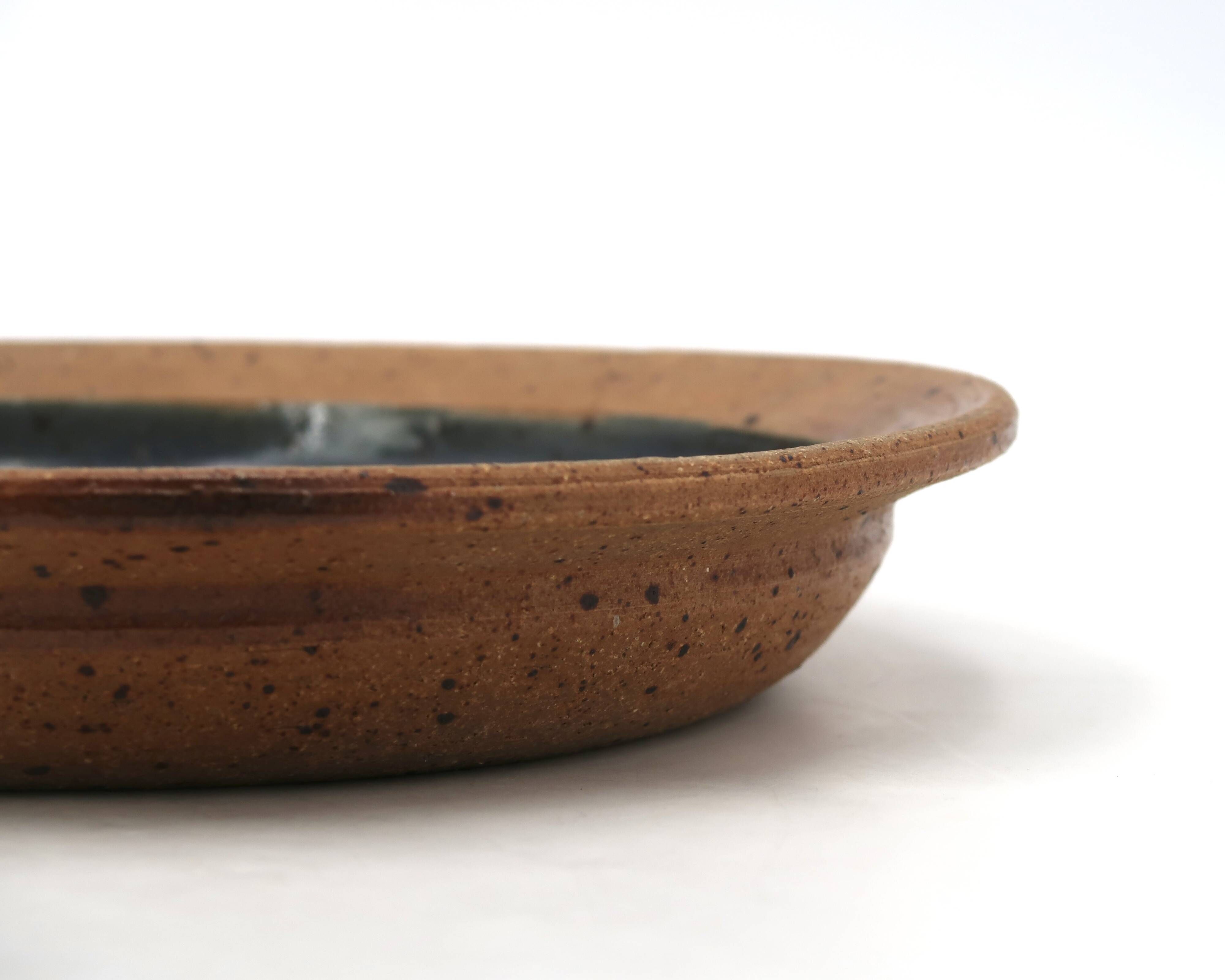 Round hollow plate in stoneware by Pierre Digan, La Borne, blue ceramic from the 1960s.