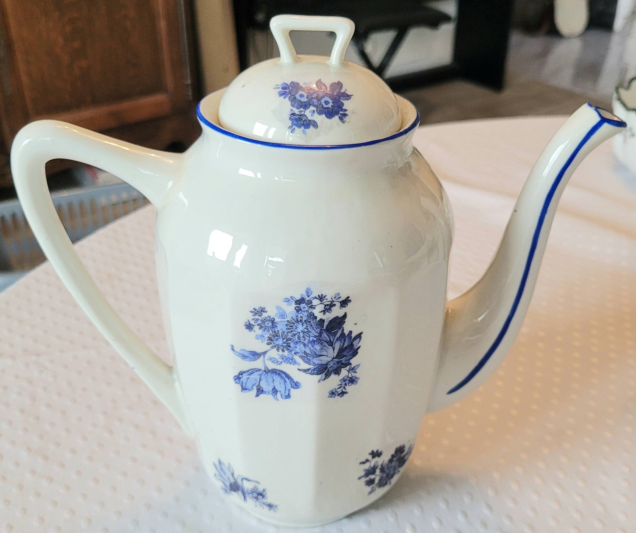 Blue and white ceramic coffee service with flowers.