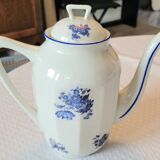 Blue and white ceramic coffee service with flowers.