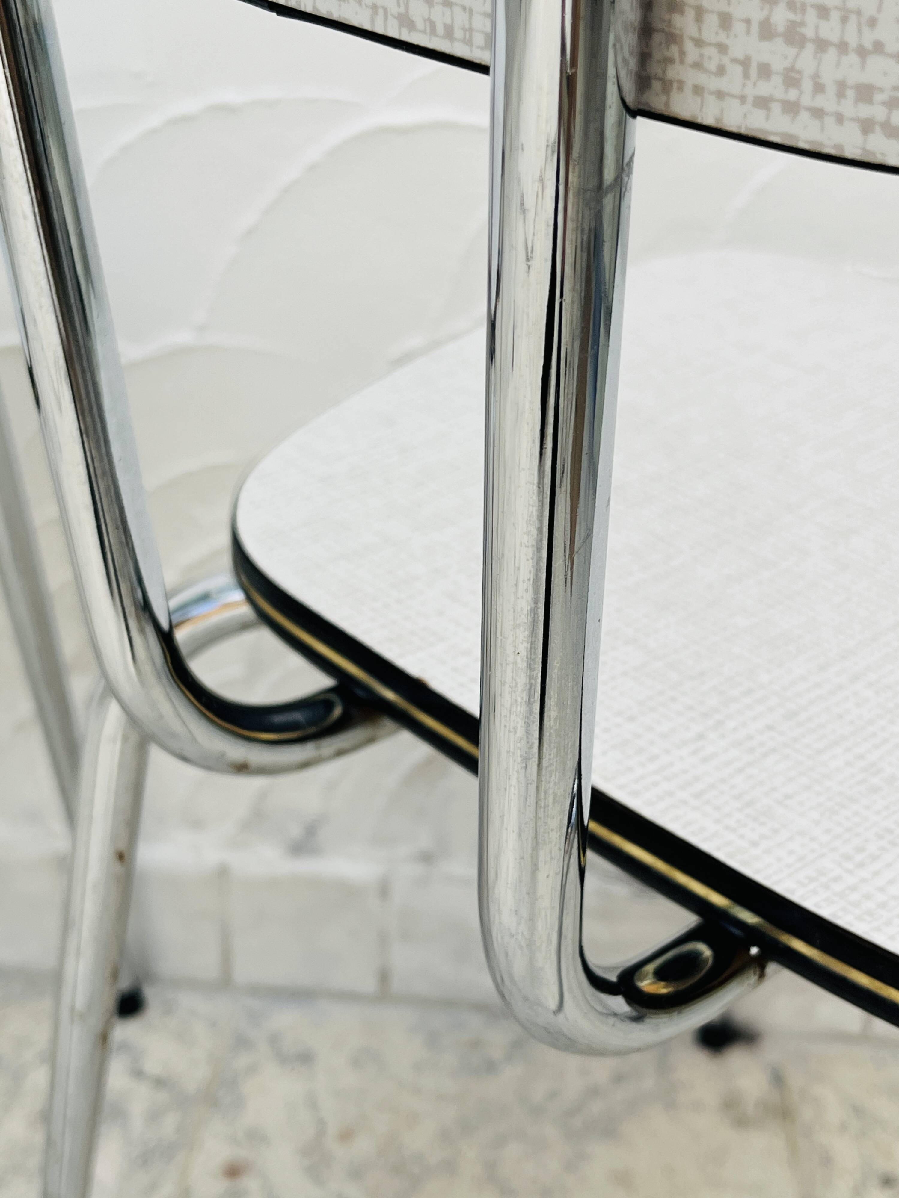 Set of two vintage grey Formica and chrome chairs.