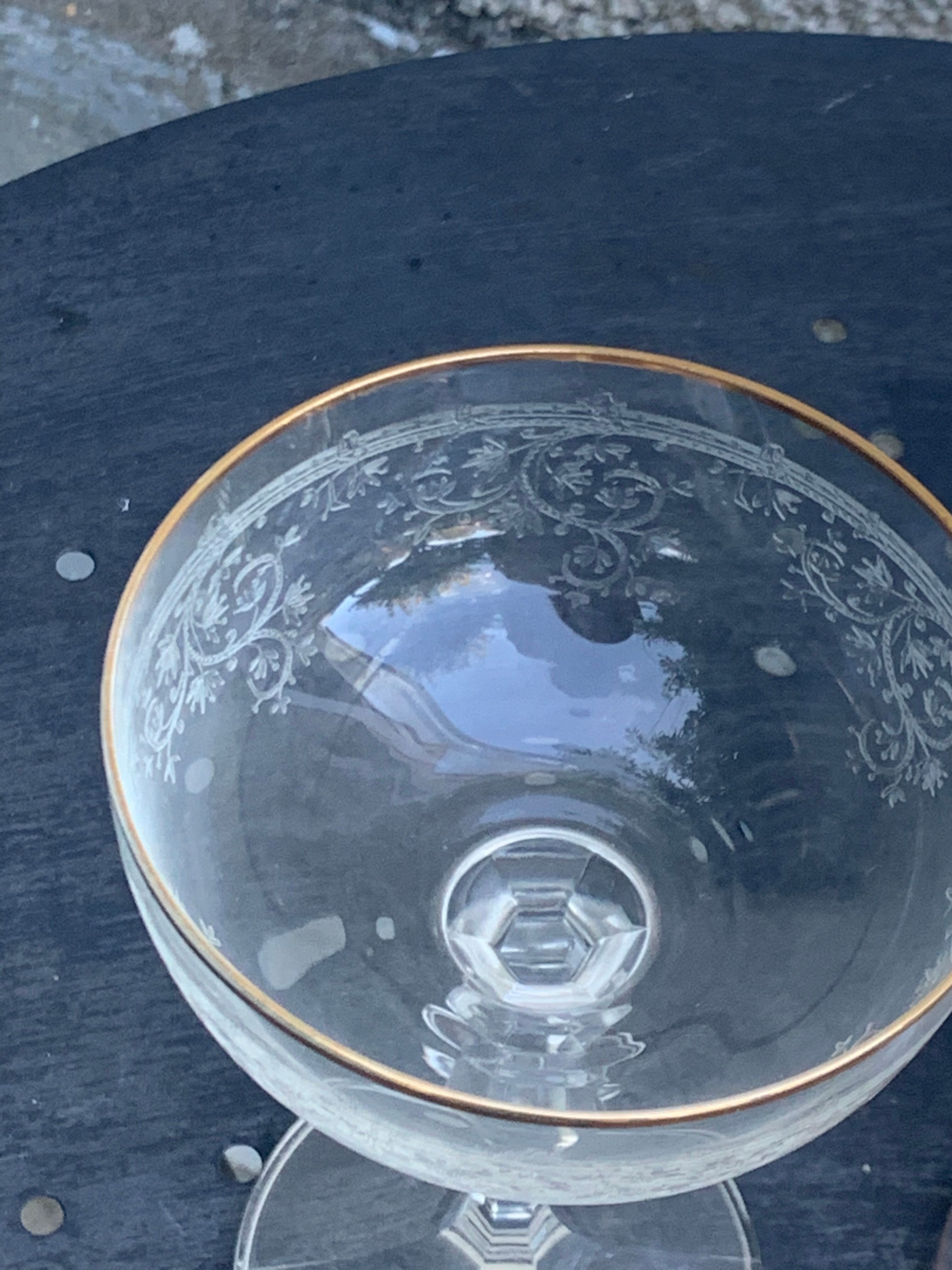 Two crystal champagne glasses and gilded borders antique engraved pattern