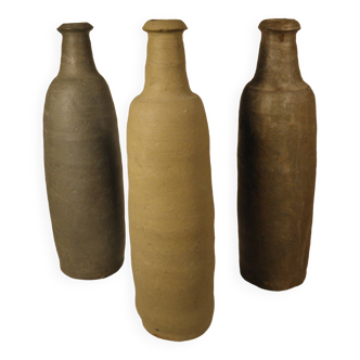 Three ancient stoneware bottles