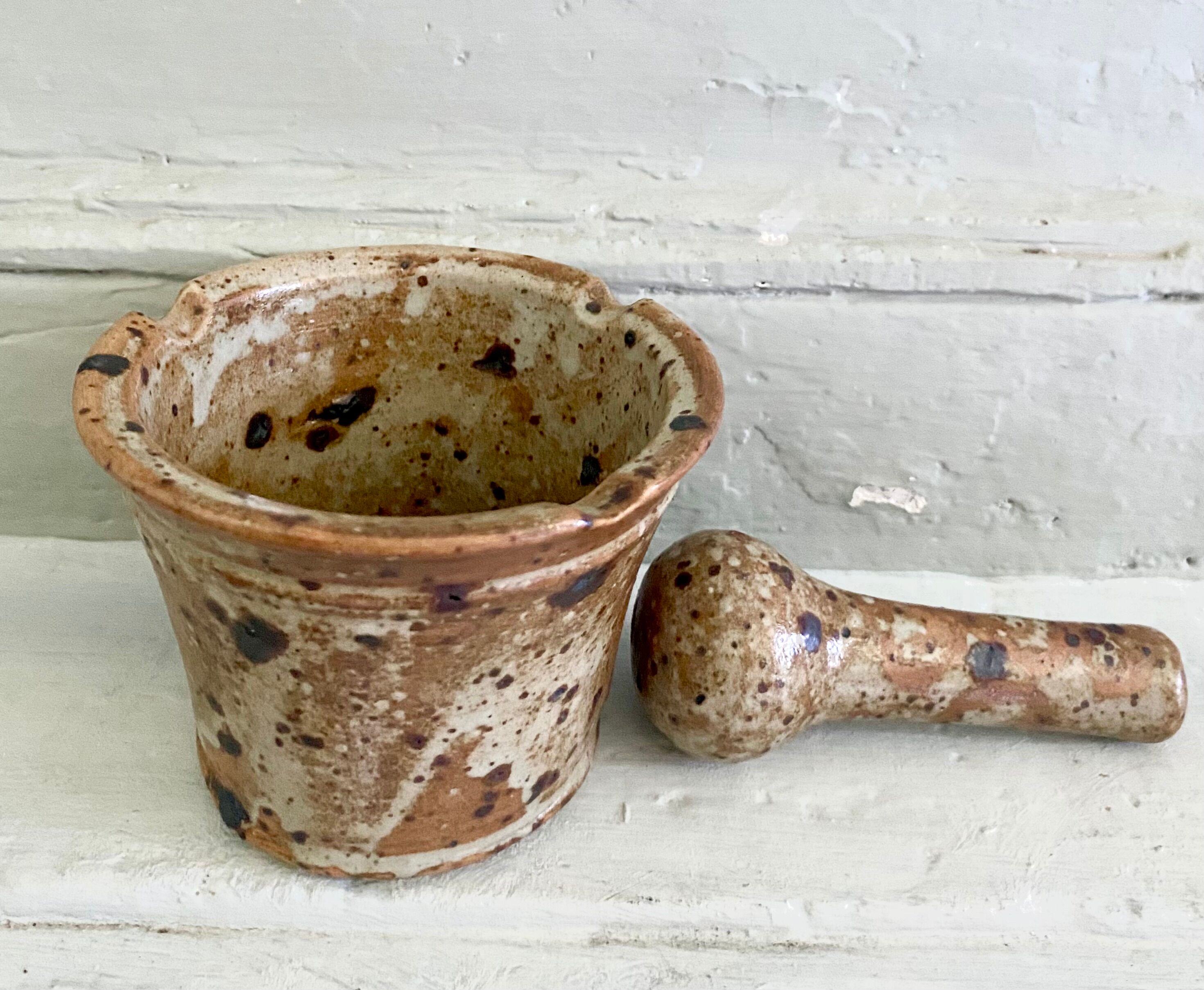 Pyrite sandstone mortar and its pestle