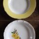 6 mismatched deep plates in floral colours from Digoin, Sarreguemines, Gien.