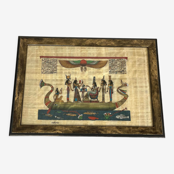 Egyptian papyrus under glass in wooden frame