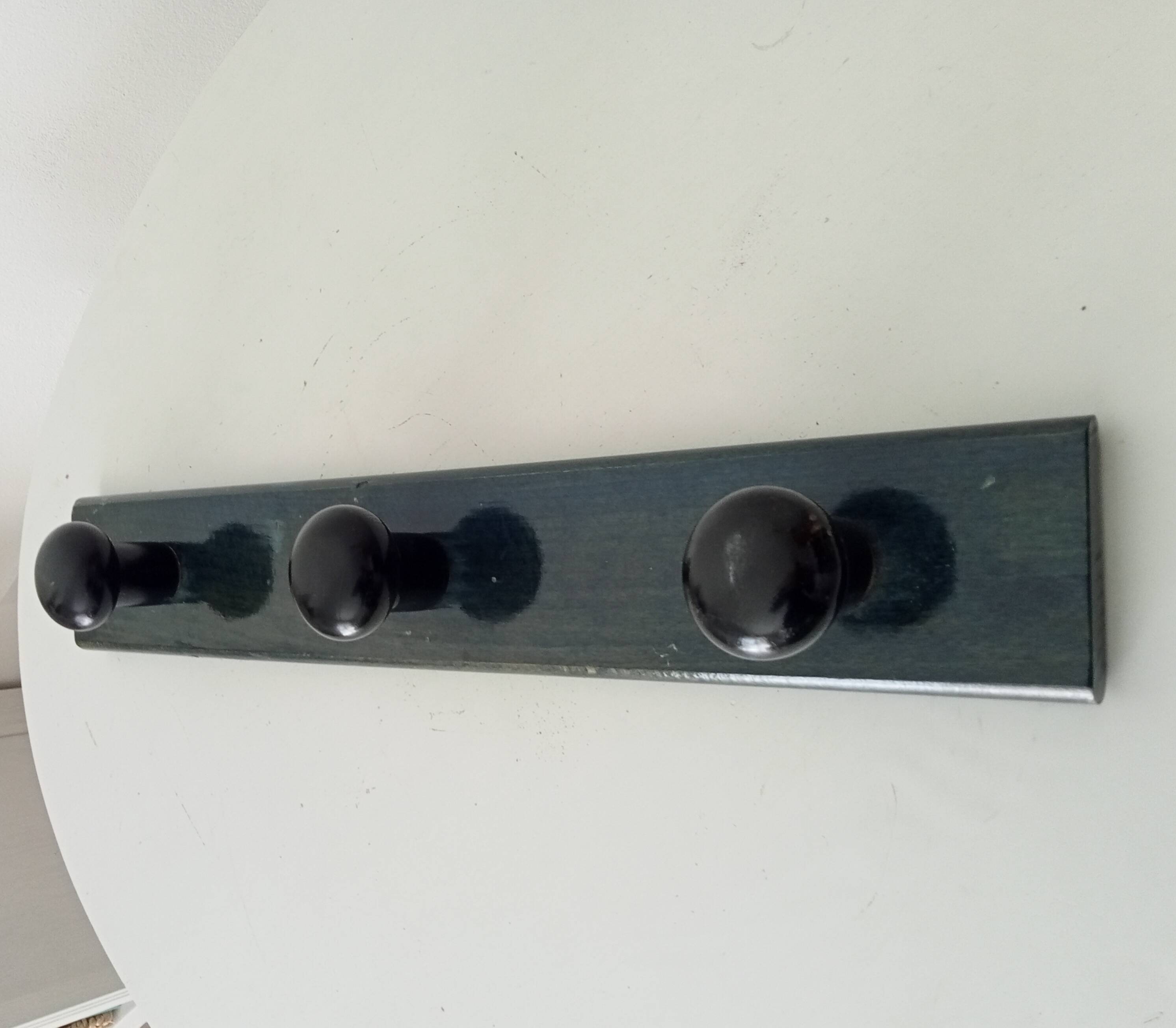 Vintage wall-mounted coat rack in lacquered wood from the 60s