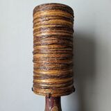 Table lamp with terracotta base and resin shade.