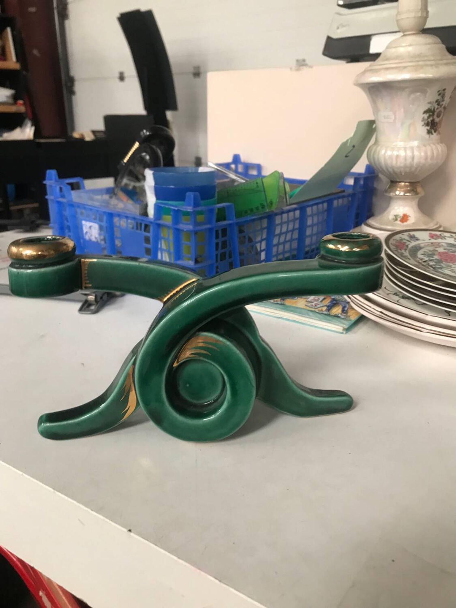Art Deco candlestick in green and gold earthenware.