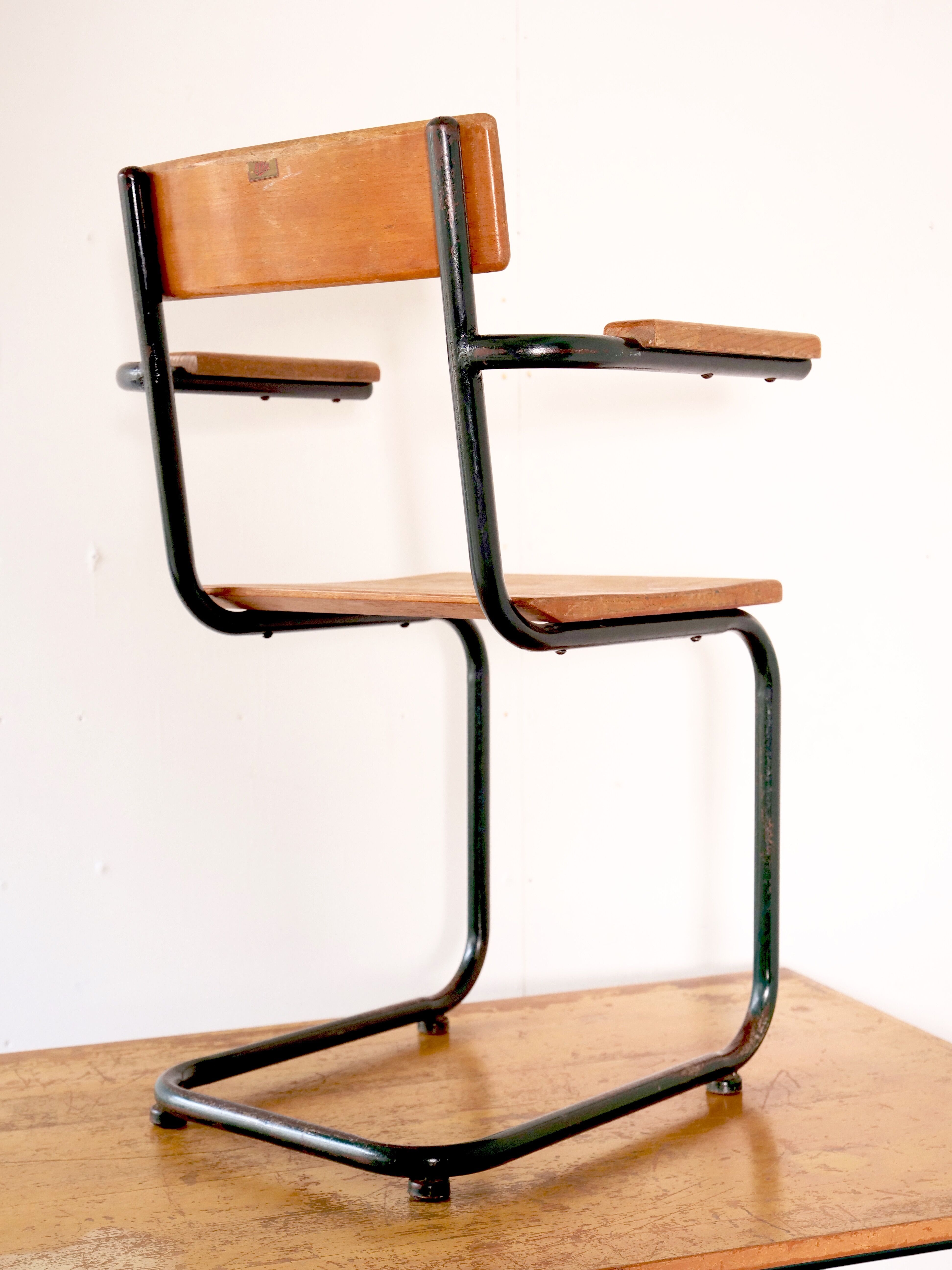 Desk with bauhaus style tubular steel chair