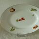 Oval dish in pâte and Limoges enamel decorated with four seasons vegetables.