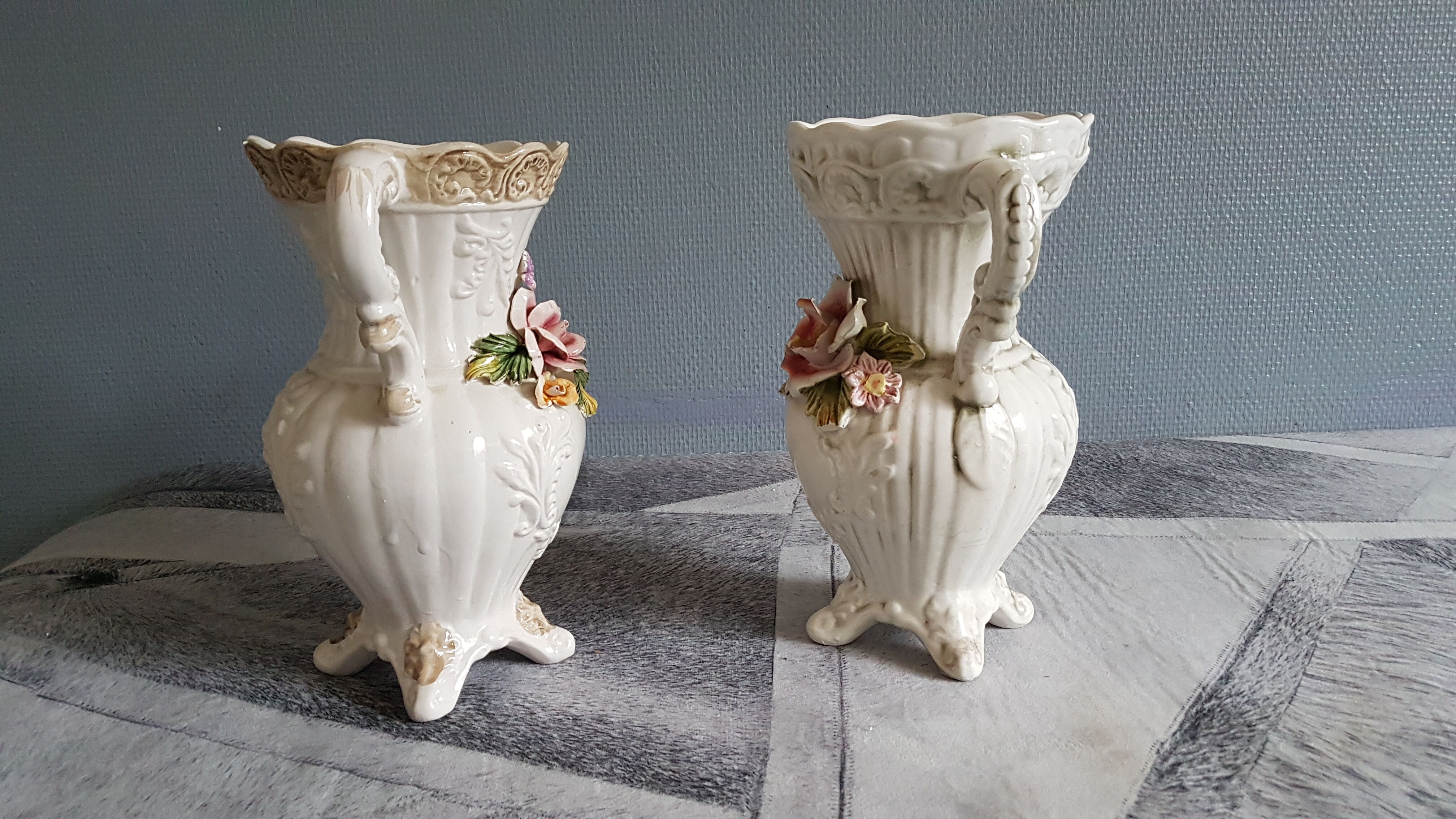 White dabbling vases with capodimonte porcelain floral decoration