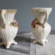White dabbling vases with capodimonte porcelain floral decoration