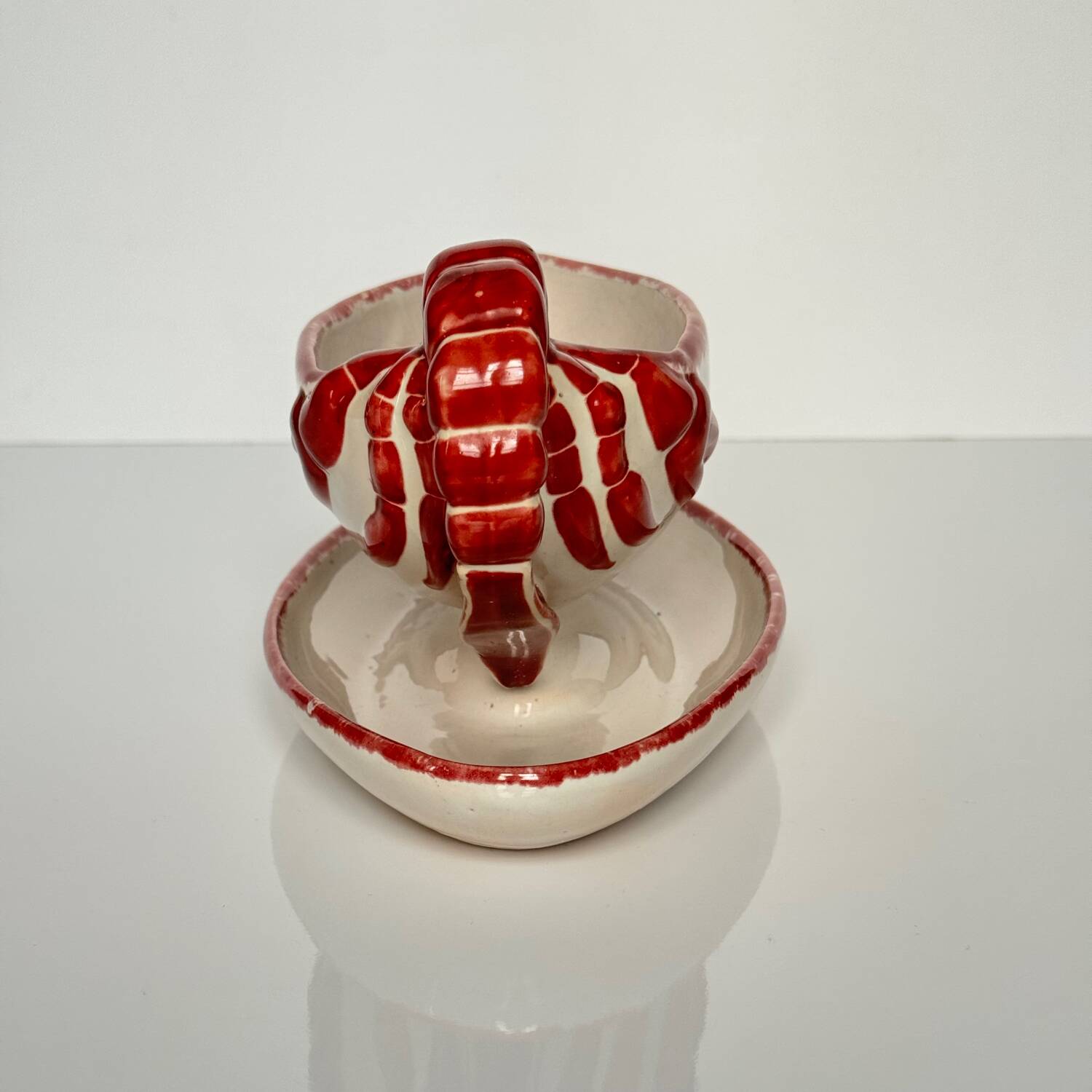 Henriot Quimper sauceboat – flower decoration & lobster-shaped handle