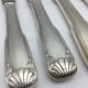 12 silver metal knives.